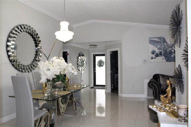 tiled dining room featuring ornamental molding and vaulted ceiling