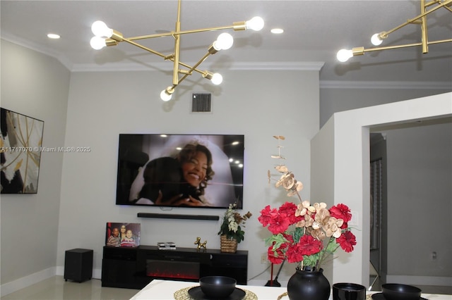 living room with crown molding and a chandelier