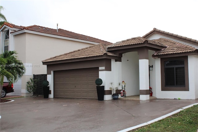 rear view of property with a garage