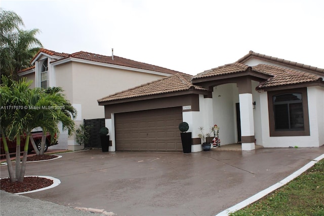 mediterranean / spanish-style house featuring a garage