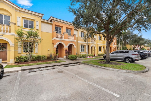 view of front of property with a balcony