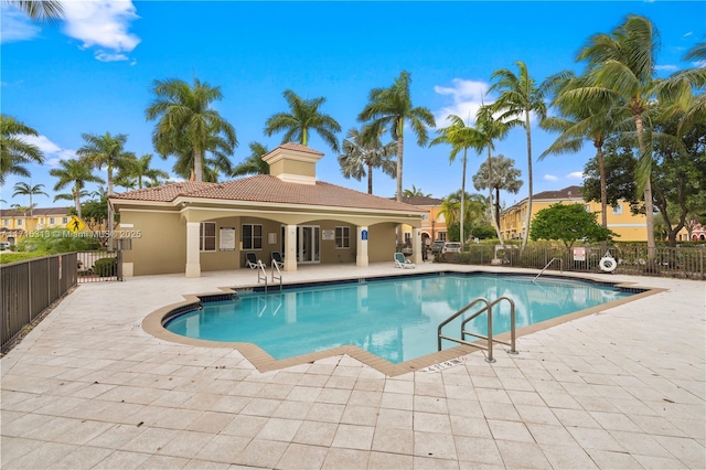 view of swimming pool with a patio