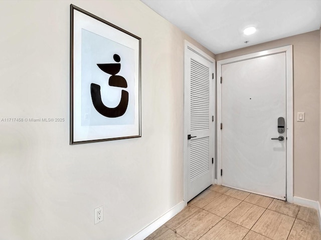 foyer with light tile patterned flooring