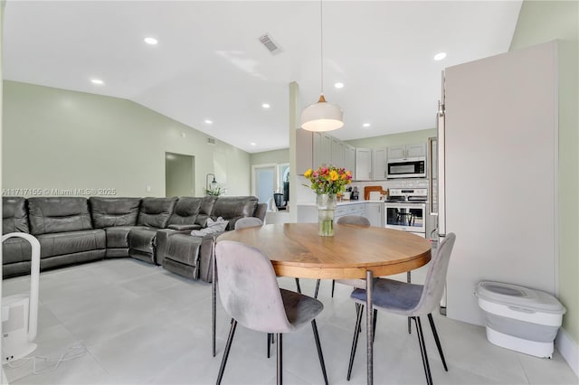 dining area with lofted ceiling