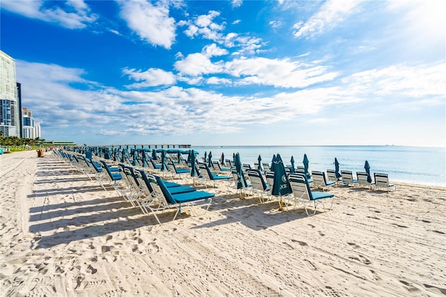 exterior space featuring a view of the beach and a water view