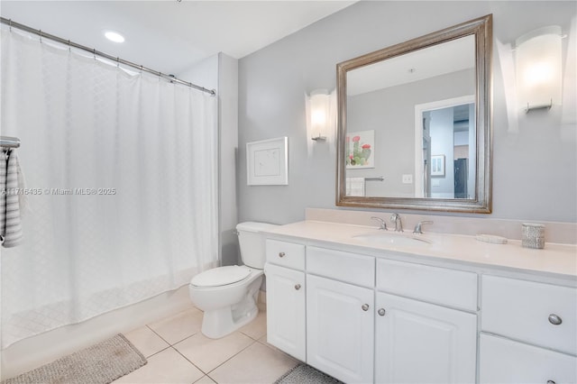 full bathroom featuring shower / bathtub combination with curtain, tile patterned floors, vanity, and toilet