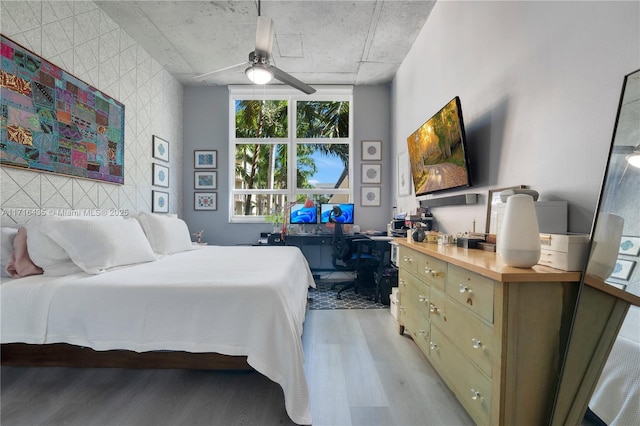 bedroom featuring ceiling fan and light hardwood / wood-style floors