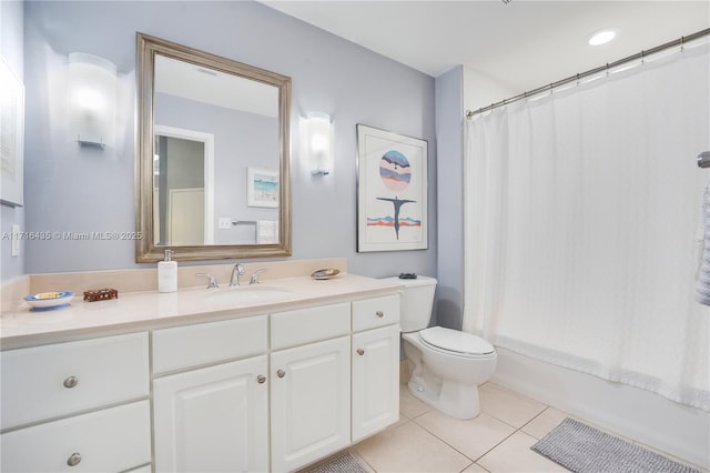 full bathroom with tile patterned floors, vanity, toilet, and shower / bath combo