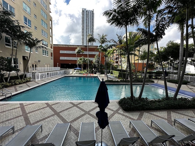 view of swimming pool with a patio