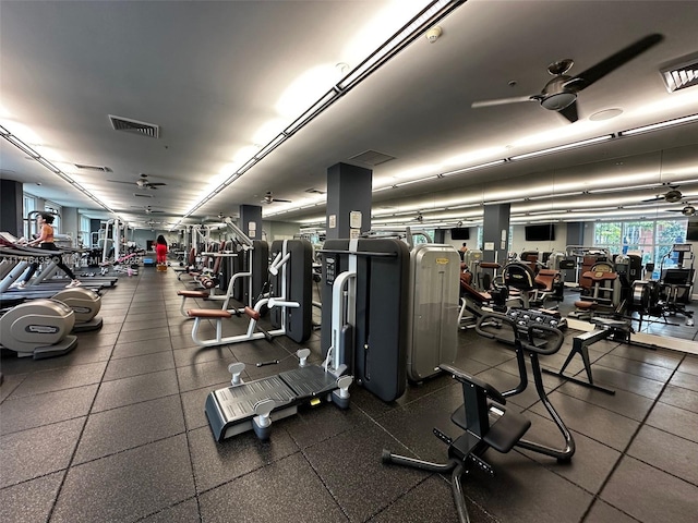 exercise room with ceiling fan