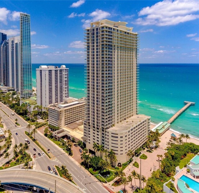 bird's eye view featuring a water view and a view of the beach