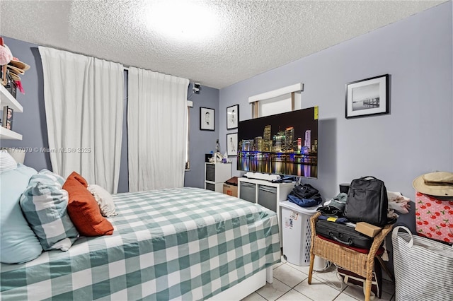 tiled bedroom with a textured ceiling