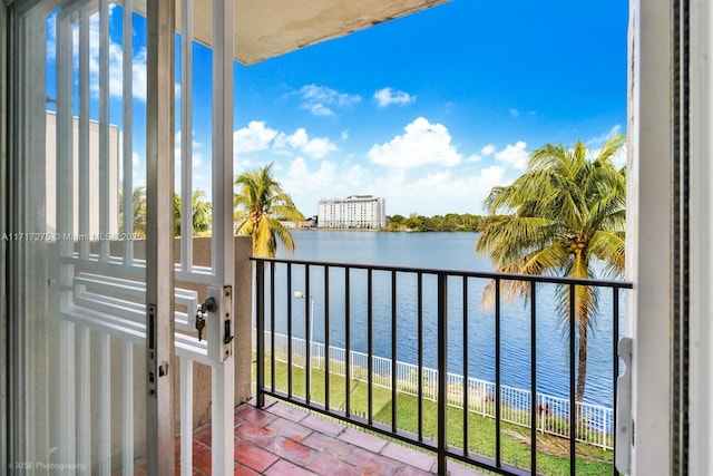 balcony featuring a water view