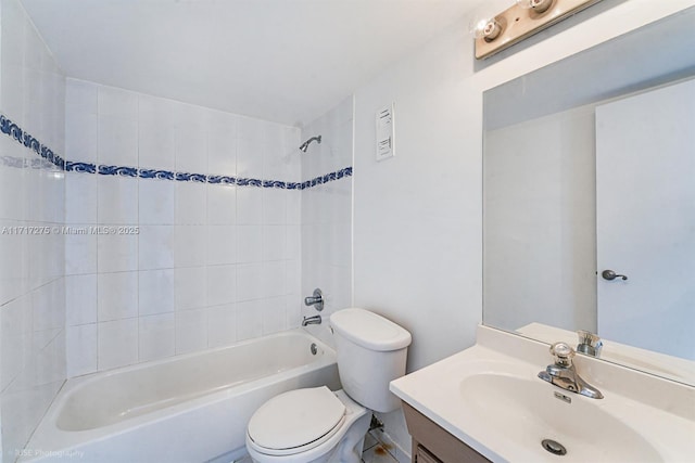 full bathroom featuring vanity, tiled shower / bath combo, and toilet