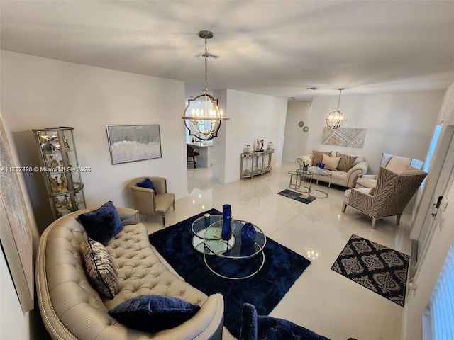 tiled living room with a chandelier