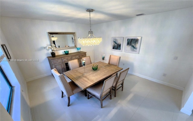 dining space featuring a chandelier