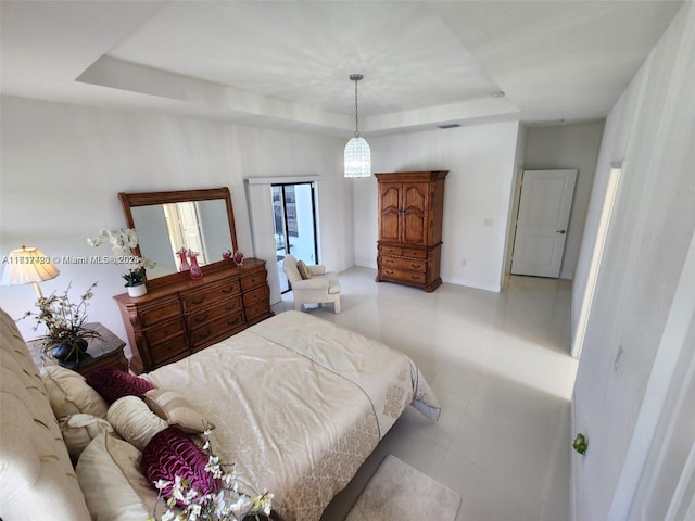 bedroom featuring a raised ceiling