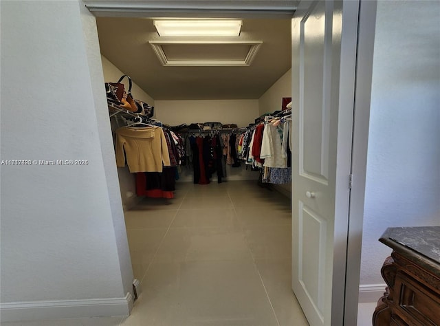 walk in closet featuring light tile patterned floors