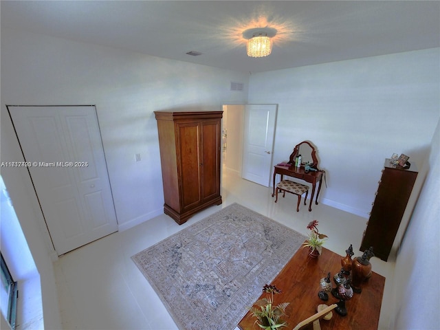 interior space with a closet and a notable chandelier