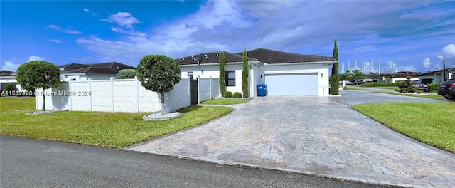 ranch-style home featuring a front yard and a garage