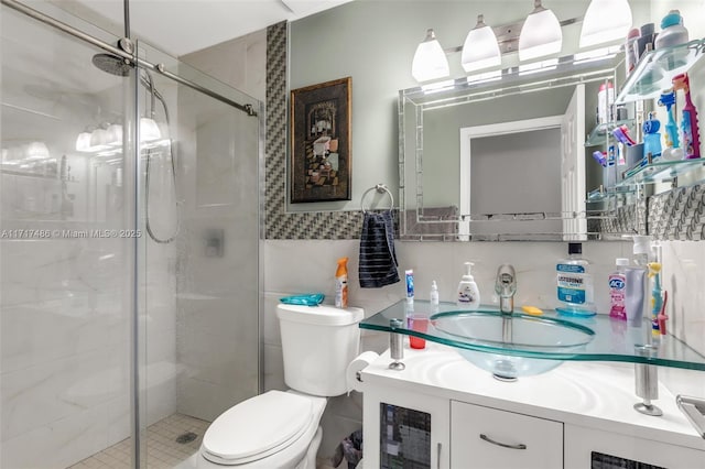 bathroom with vanity, an enclosed shower, and toilet