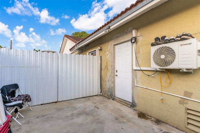 view of home's exterior with ac unit and a patio