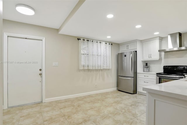 kitchen featuring white cabinets, black range with electric cooktop, stainless steel refrigerator, and wall chimney exhaust hood