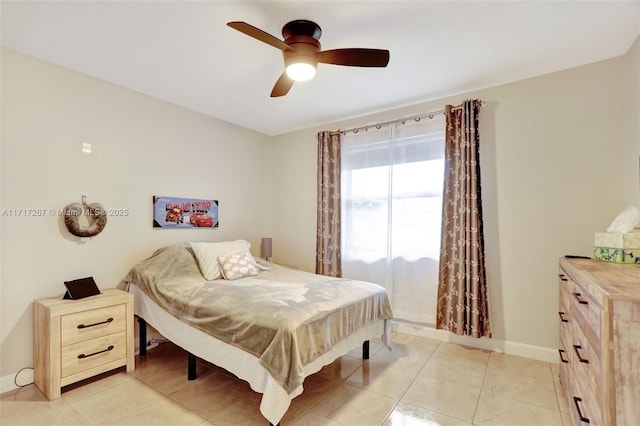 bedroom with ceiling fan and light tile patterned floors