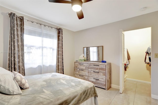 bedroom featuring ceiling fan and light tile patterned flooring