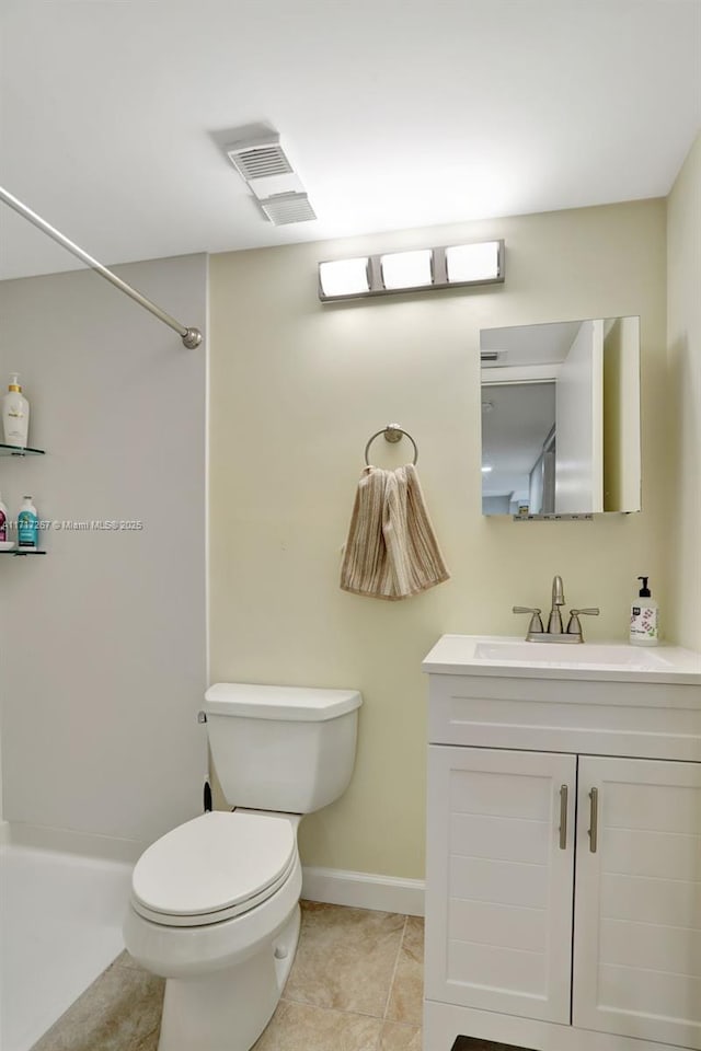 bathroom with a shower, tile patterned flooring, vanity, and toilet