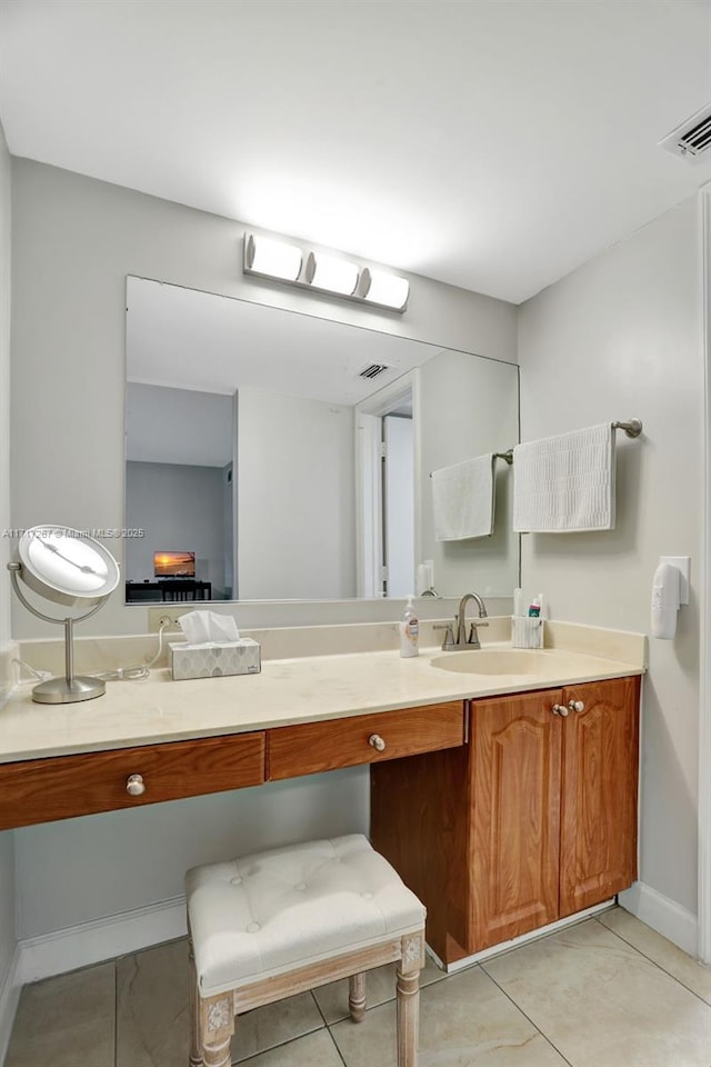 bathroom featuring tile patterned floors and vanity