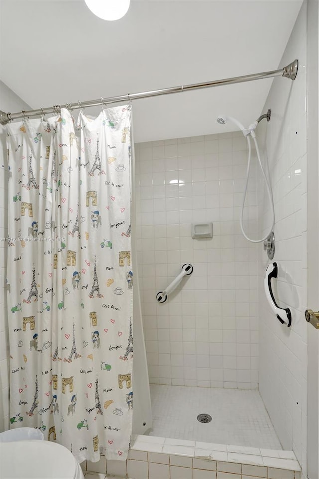 bathroom with toilet and walk in shower