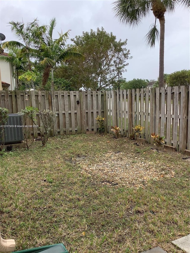 view of yard with central AC unit