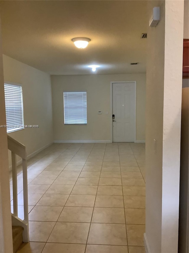 interior space featuring light tile patterned floors