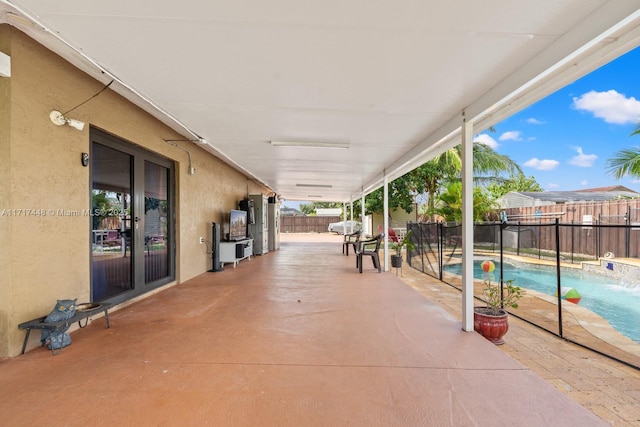 view of patio with a fenced in pool