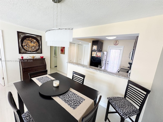 dining area with a textured ceiling