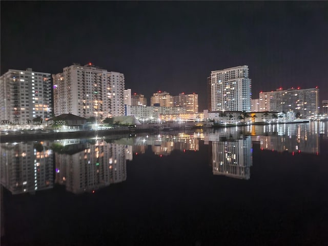 property's view of city featuring a water view