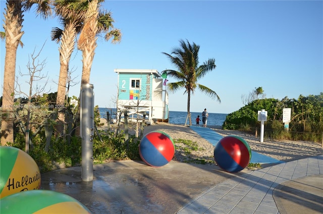 view of community with a water view