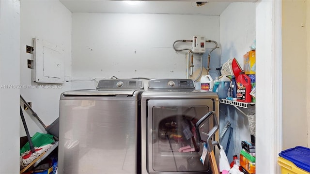 laundry room with independent washer and dryer and electric panel