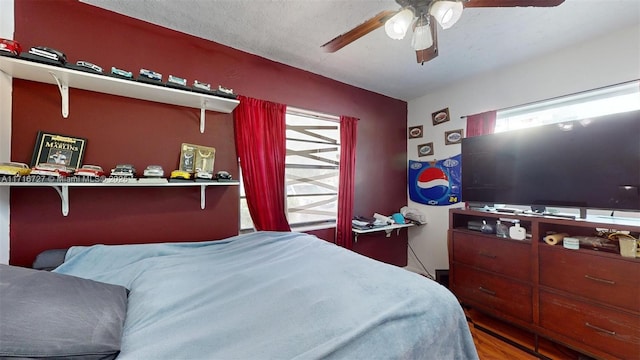 bedroom featuring hardwood / wood-style floors and ceiling fan