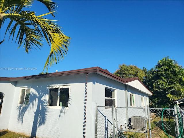 view of home's exterior with central AC unit