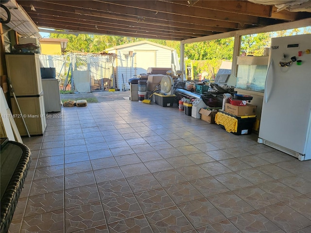 view of patio with a storage unit