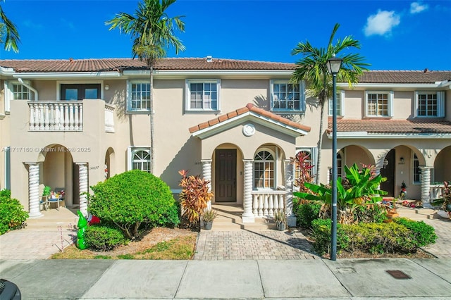 mediterranean / spanish-style home featuring a balcony