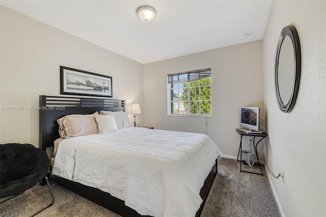 bedroom featuring dark carpet