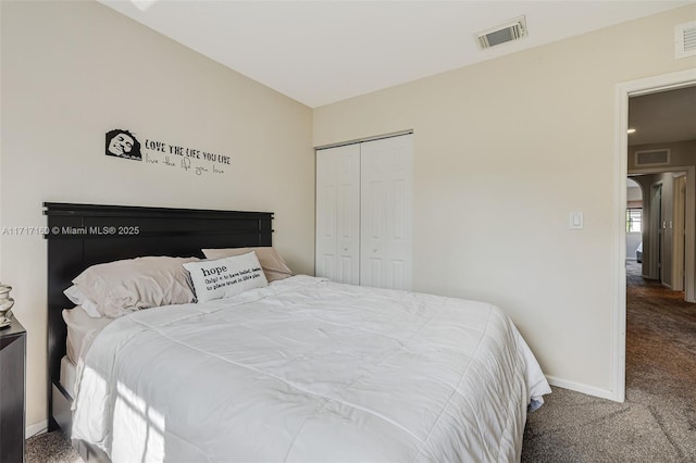 bedroom with carpet and a closet