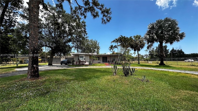 single story home featuring a front yard