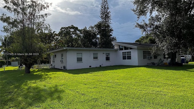 back of house with a yard