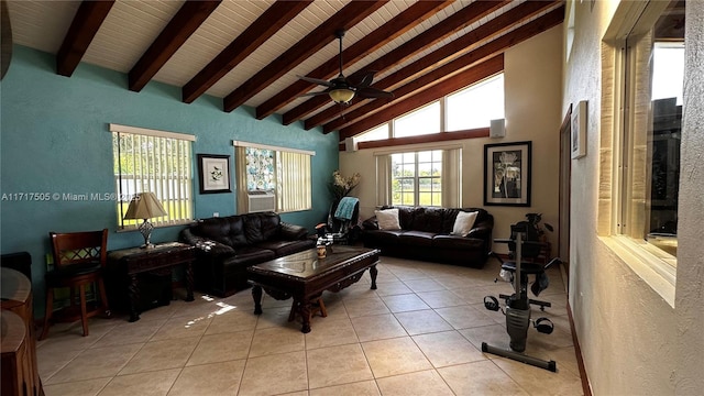 living room featuring beamed ceiling, ceiling fan, light tile patterned floors, and high vaulted ceiling