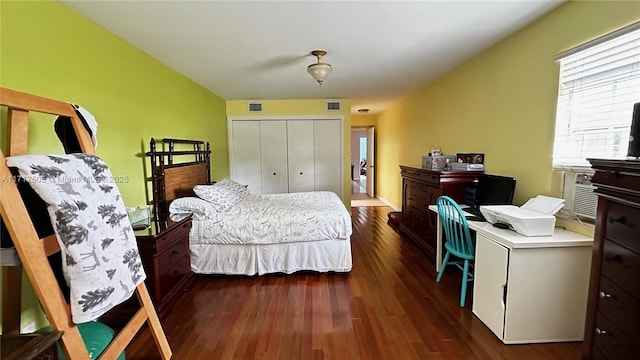 bedroom featuring a closet and dark hardwood / wood-style floors