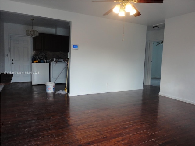 unfurnished room with washing machine and dryer, dark hardwood / wood-style floors, and ceiling fan